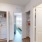washer and dryer with shelves above
