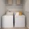 washer and dryer with shelves above