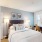 bedroom with bed and large window