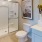 bathroom with sink and large mirror