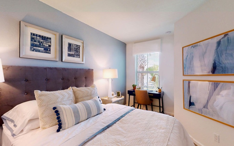 bedroom with bed and wall art