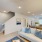 living room with a couch and view of the kitchen