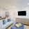 living room with a couch coffee table and tv