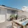 outdoor patio with table seating and fence