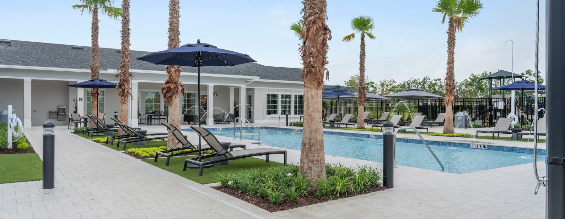 Resort-style swimming pool with lounge seating