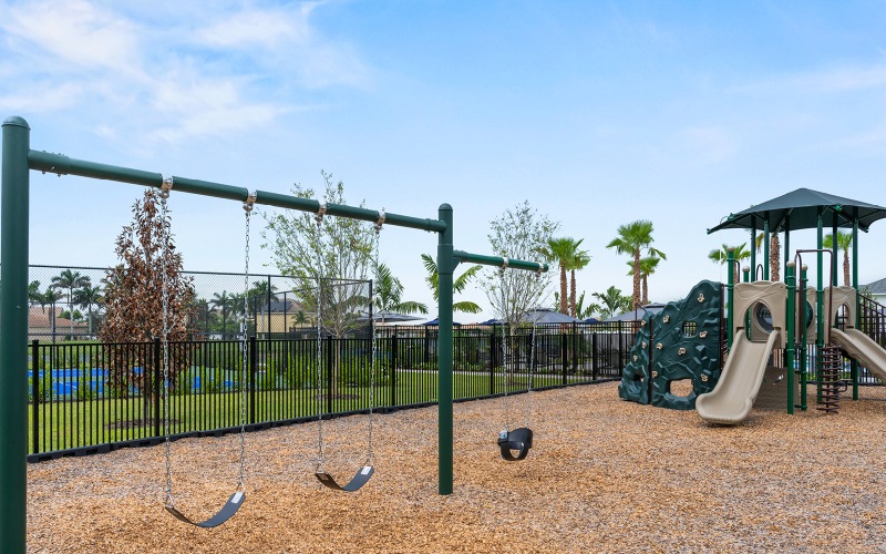 A playground with swings and a slide